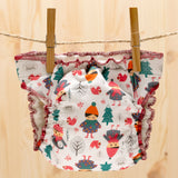 Culla di Teby Höschenwindel mit Pocketfunktion im Design Childhood auf der Wäscheleine