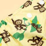 Nahaufnahme der Little Clouds Prefold-Überhose aus PUL im Design Affe mit Druckknöpfen und Äffchenmotiv
